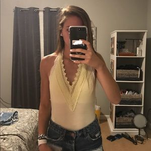 Yellow lace v body suit